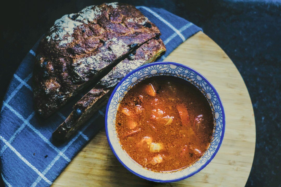 Hearty Czech style beef goulash in a bowl with bread