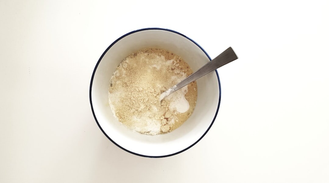 rising bread dough in bowl
