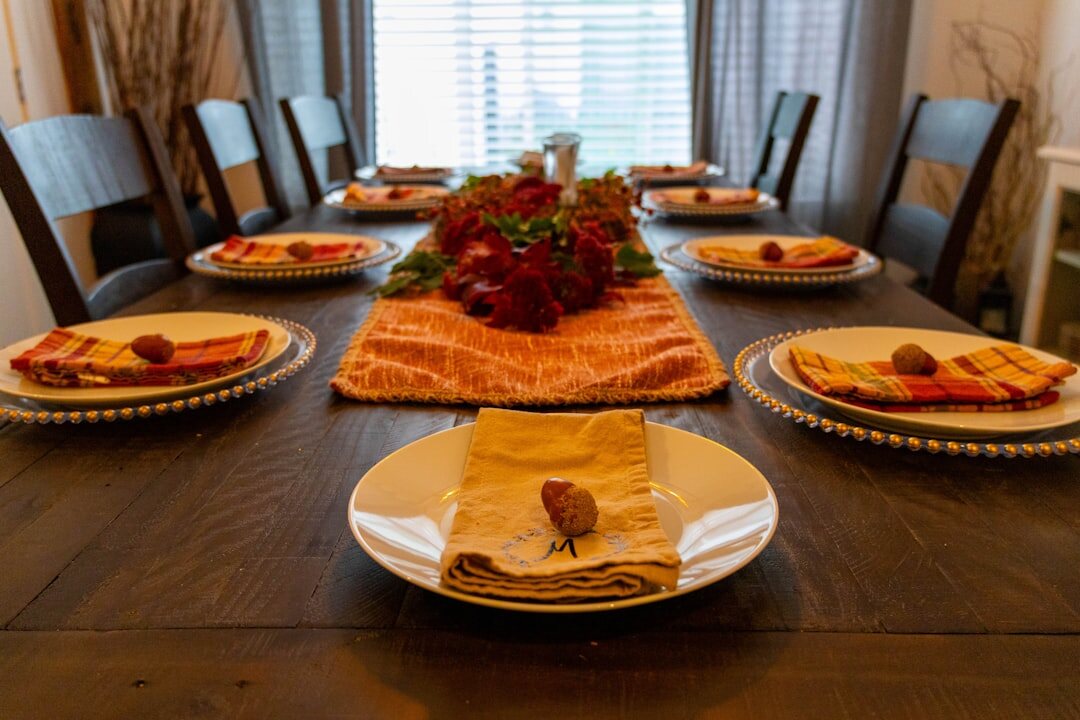 Family dinner table set with home cooked dishes