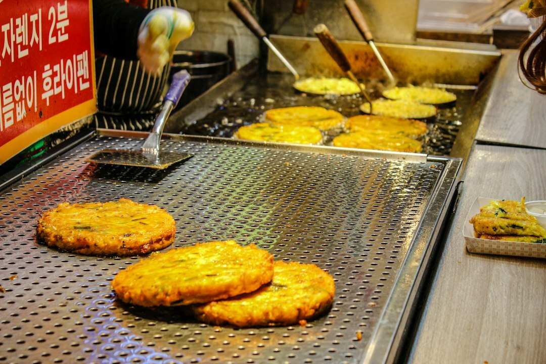 Golden fried Czech potato pancakes stacked on a plate